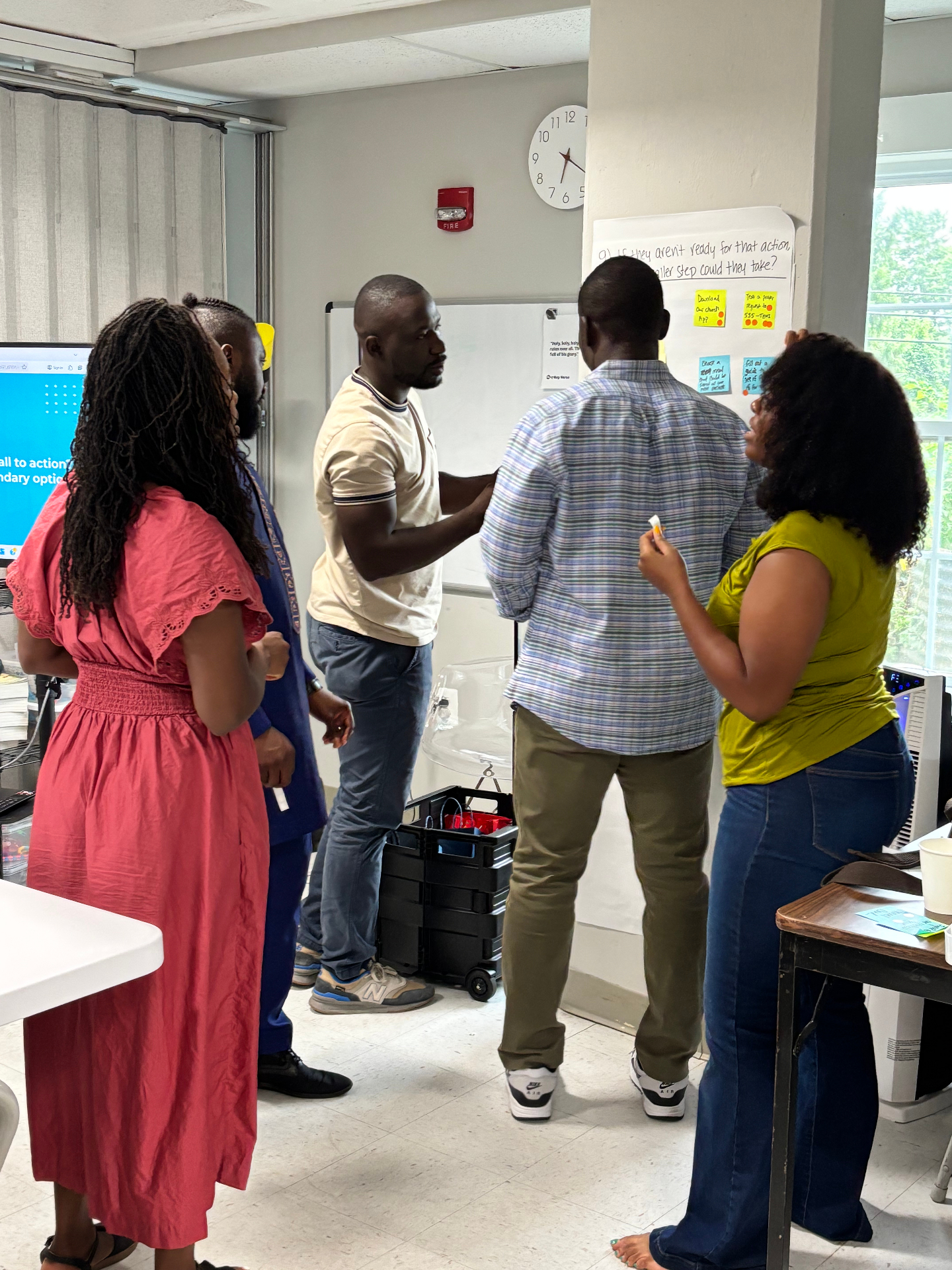 Church leaders mapping next steps on sticky notes during a coaching session with Tyler