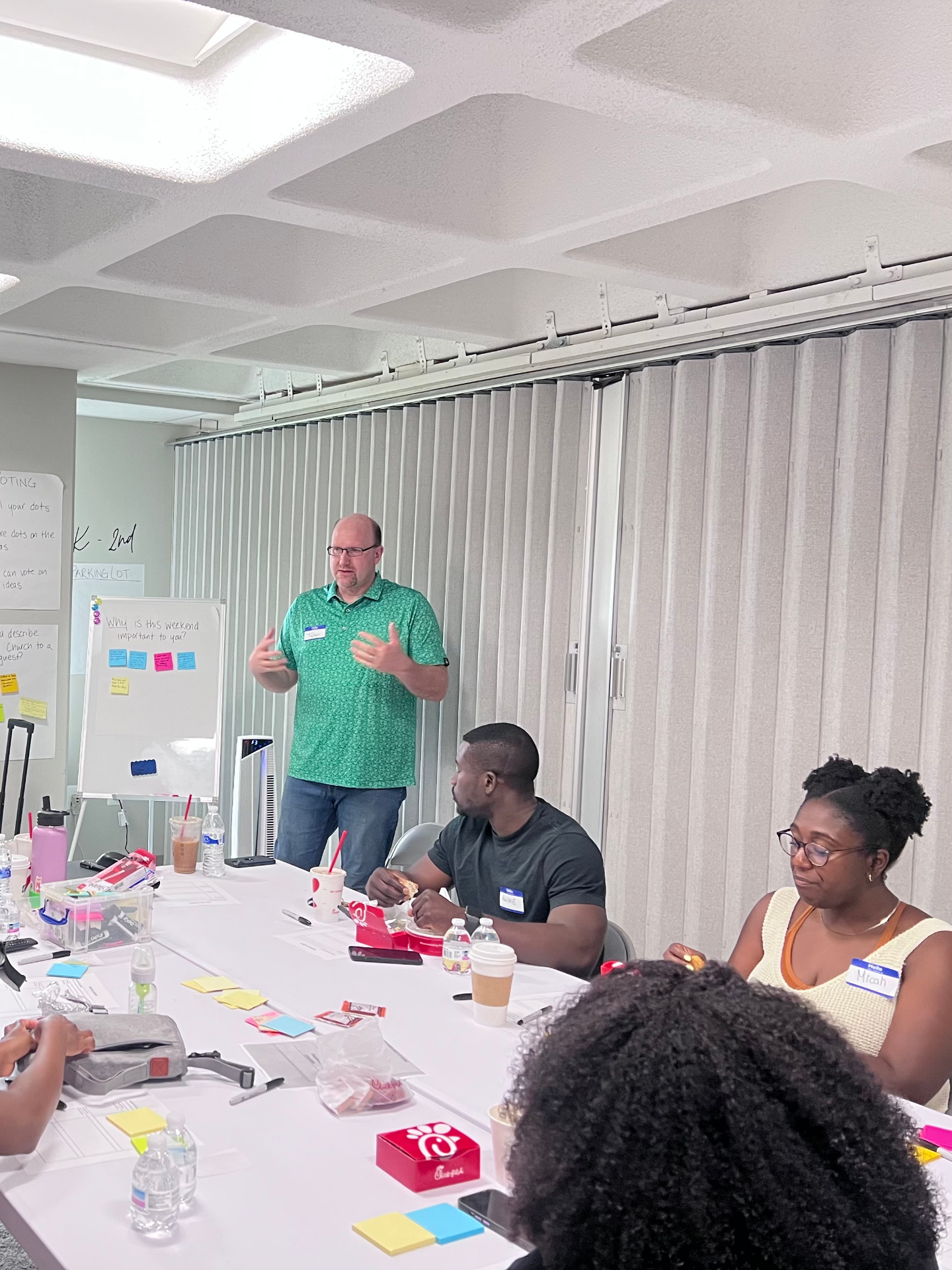 Tyler facilitating a small-group workshop with pastors around the table